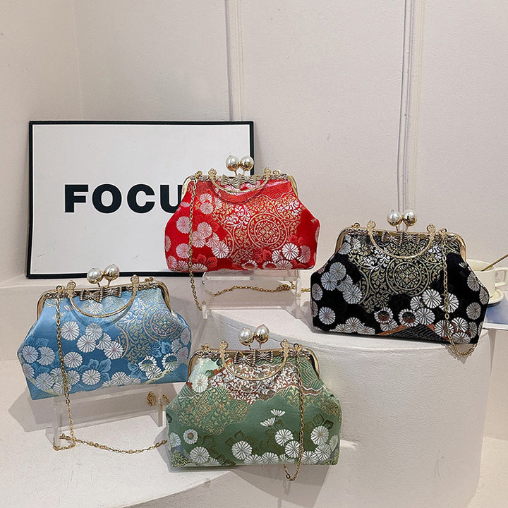 Damen elegante Umhängetasche mit floralem Design und Kunstlederakzenten Nord Taschen