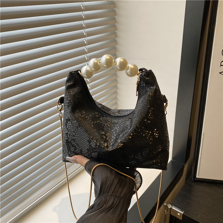 Damen Umhängetasche mit Perlenhenkel und eleganter Schlangenprägung Nord Taschen