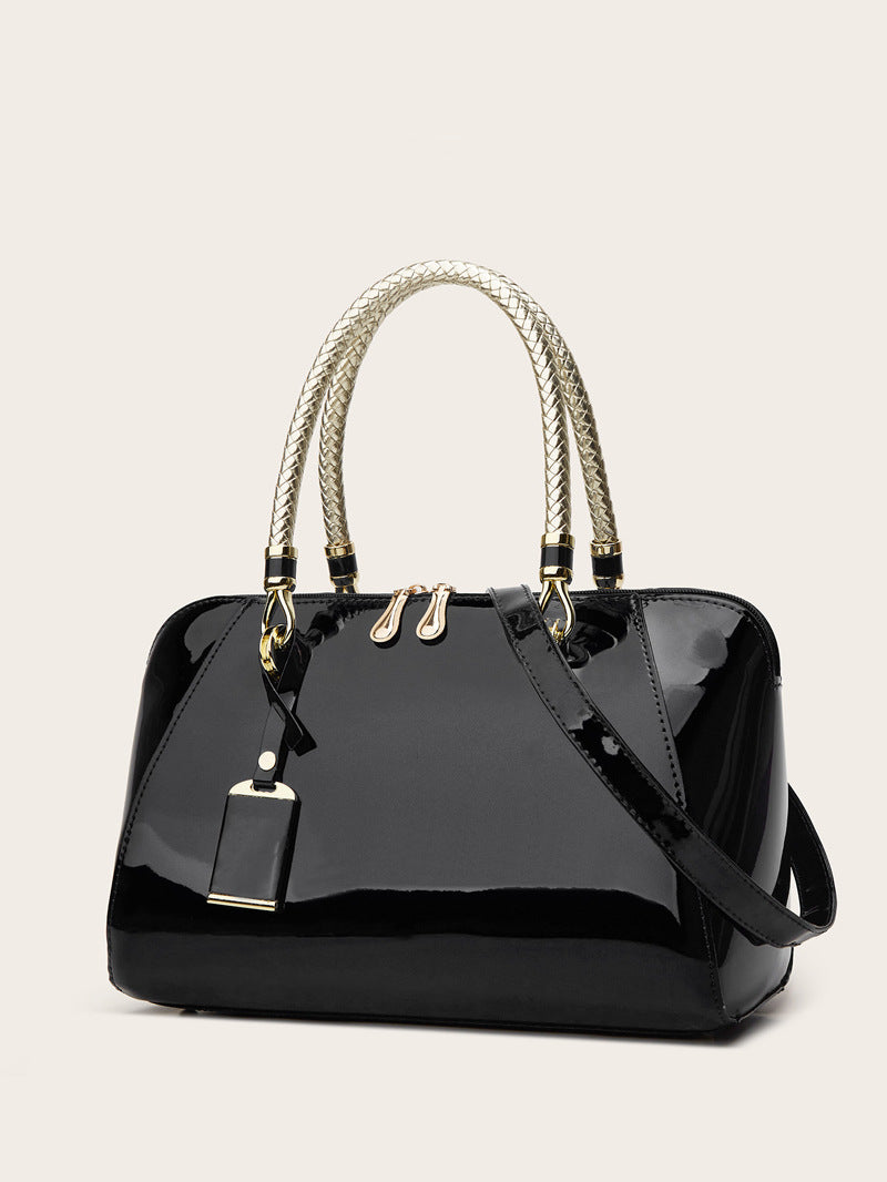 Damen Handtasche mit eleganter Lackoberfläche und geflochtenen Griffen Nord Taschen