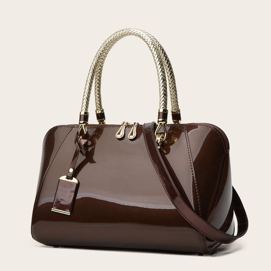 Damen Handtasche mit eleganter Lackoberfläche und geflochtenen Griffen Nord Taschen