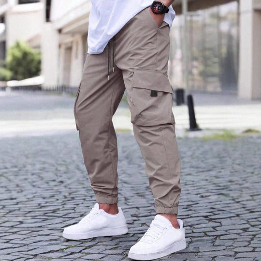 Herren technische Travel-Joggerhose mit integriertem Sicherheitsfach elastischem Tunnelzugbund und wasserabweisender Beschichtung Nord Taschen