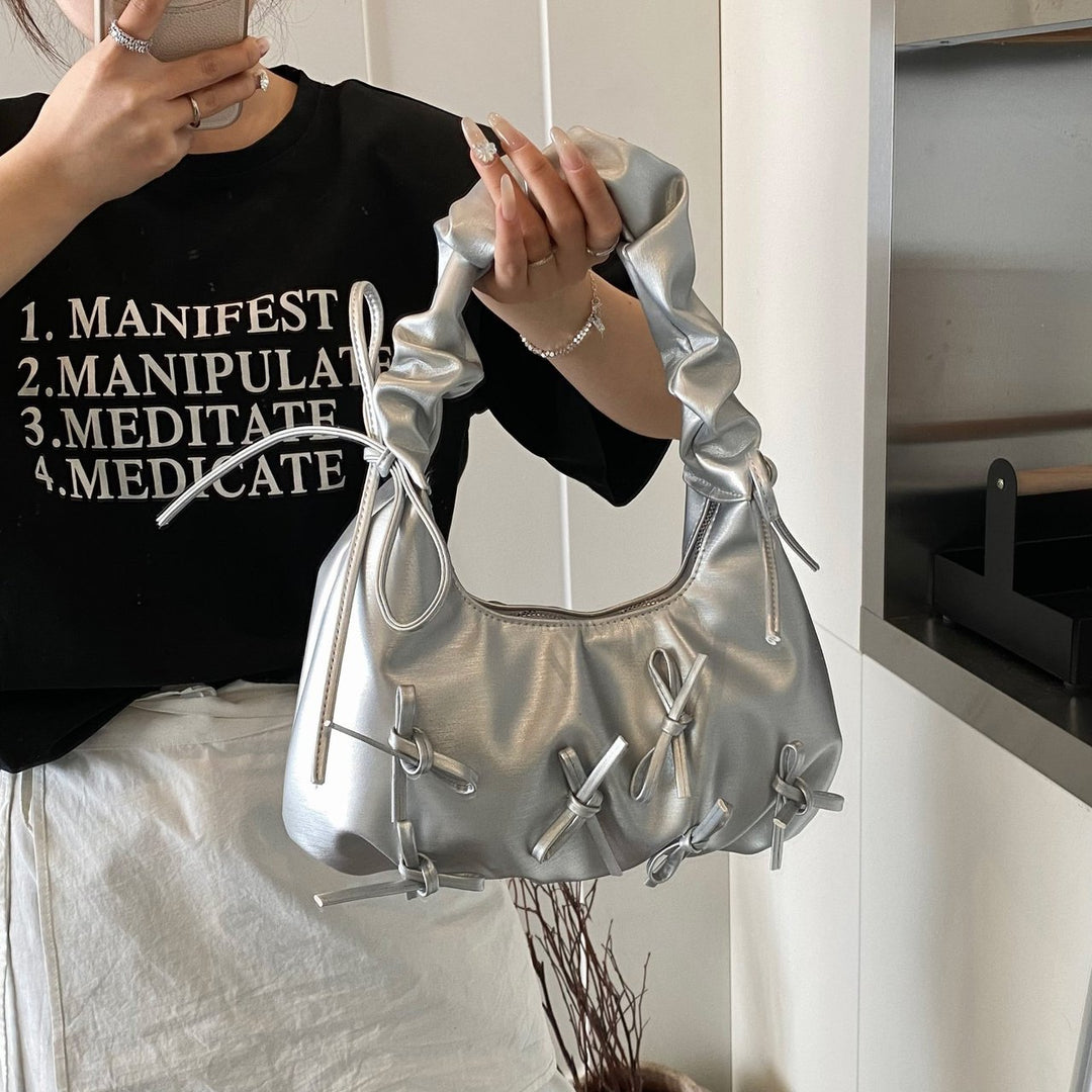 Damen Handtasche mit raffinierten Schleifen-Details und elegantem Tragegriff Nord Taschen