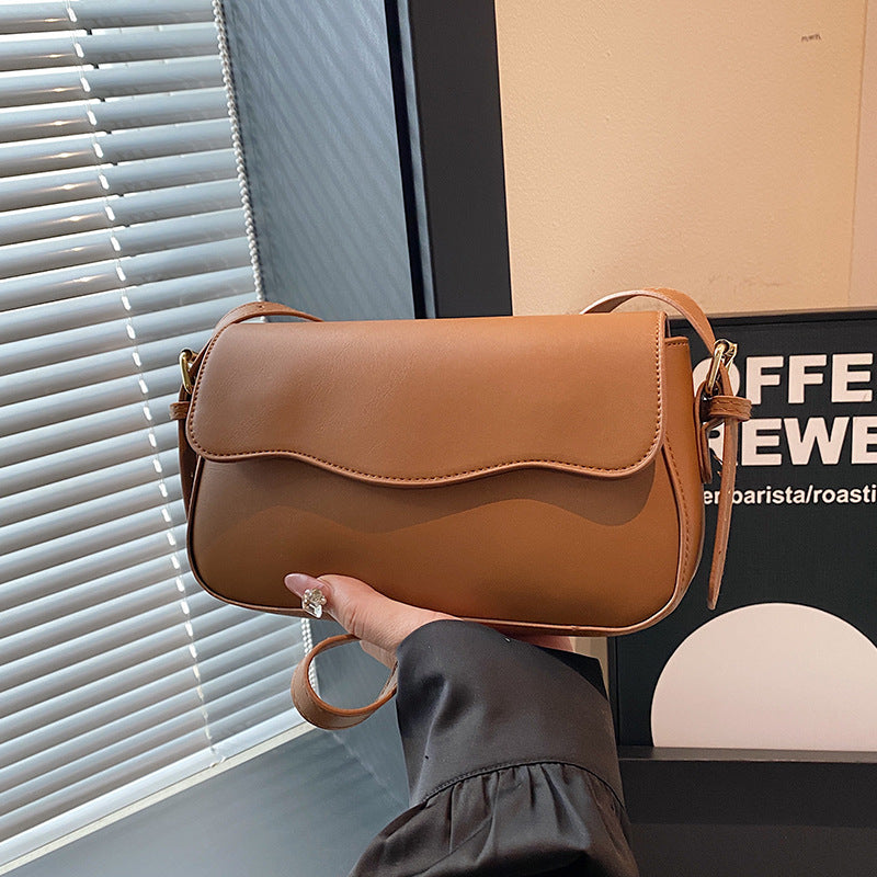 Damen Umhängetasche mit elegantem Wellenmuster Nord Taschen