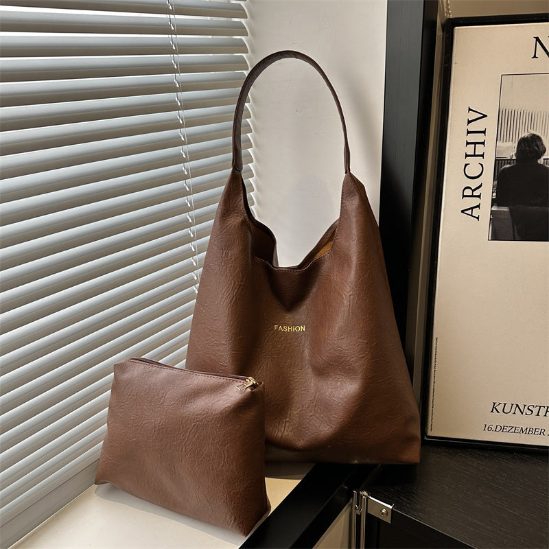 Damen elegante Umhängetasche aus kunstleder mit einer passenden Kosmetiktasche Nord Taschen