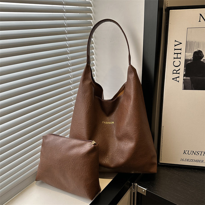 Damen elegante Umhängetasche aus kunstleder mit einer passenden Kosmetiktasche Nord Taschen