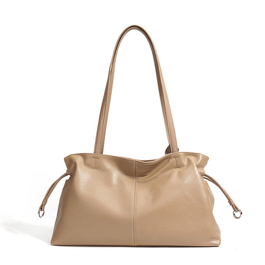 Damen Handtasche aus hochwertigem Kunstleder mit auffälligem Quastenanhänger Nord Taschen