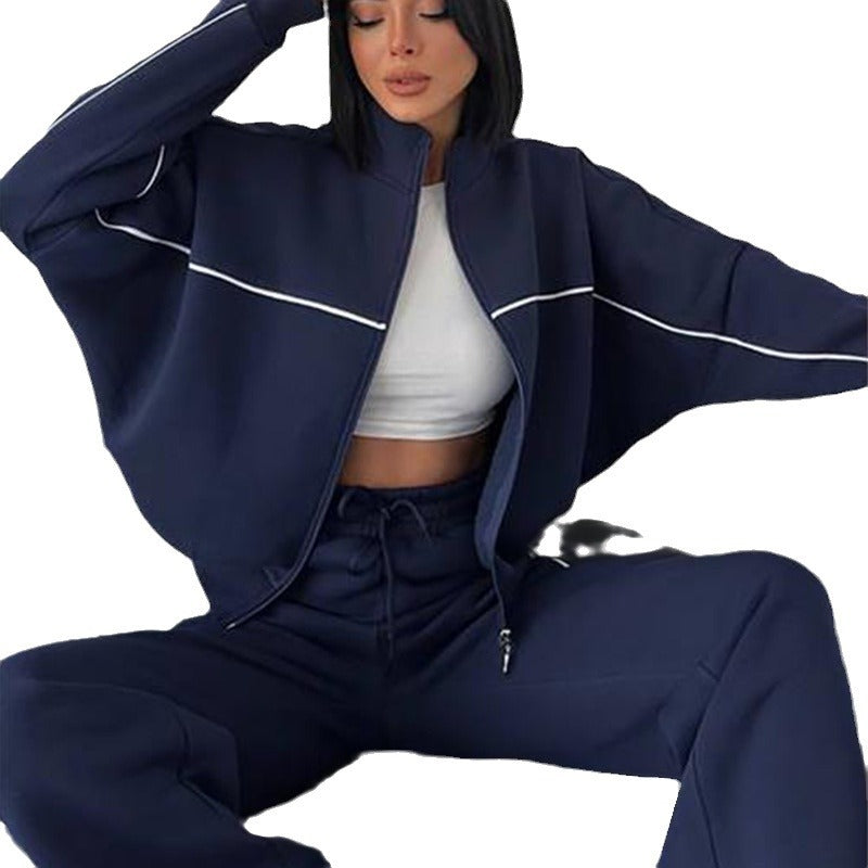 Damen lässiges Sweatset mit Stehkragen Reißverschluss gekürzter Jacke und hochtaillierter Schlaghose Nord Taschen