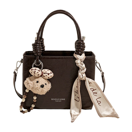 Damen Handtasche mit integriertem Tragegurt und geflochtenen Details Nord Taschen