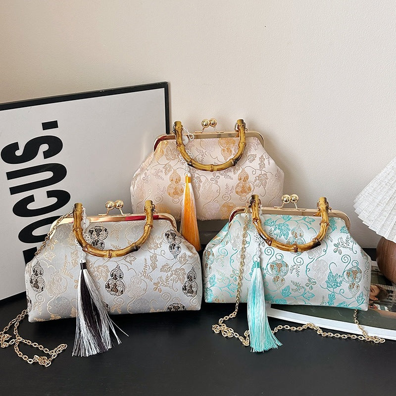 Damen elegante Handtasche mit Bambusgriffen und floralem Design Nord Taschen