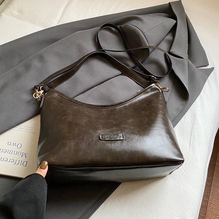 Damen Hobo-Tasche mit elegantem Design und dekorativem Quastenanhänger Nord Taschen