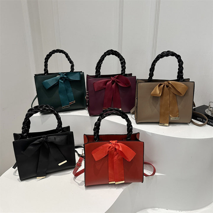 Damen elegante Handtasche mit geflochtenem Ledergriff und Schleifenakzent Nord Taschen