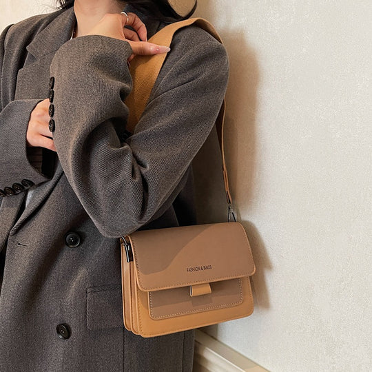 Damen Umhängetasche mit innovativem Klappverschluss und hochwertigen Akzenten Nord Taschen