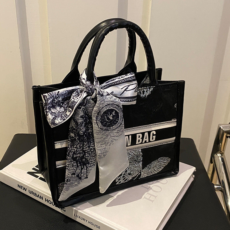 Damen Handtasche im eleganten Design mit dekorativem Schal Nord Taschen