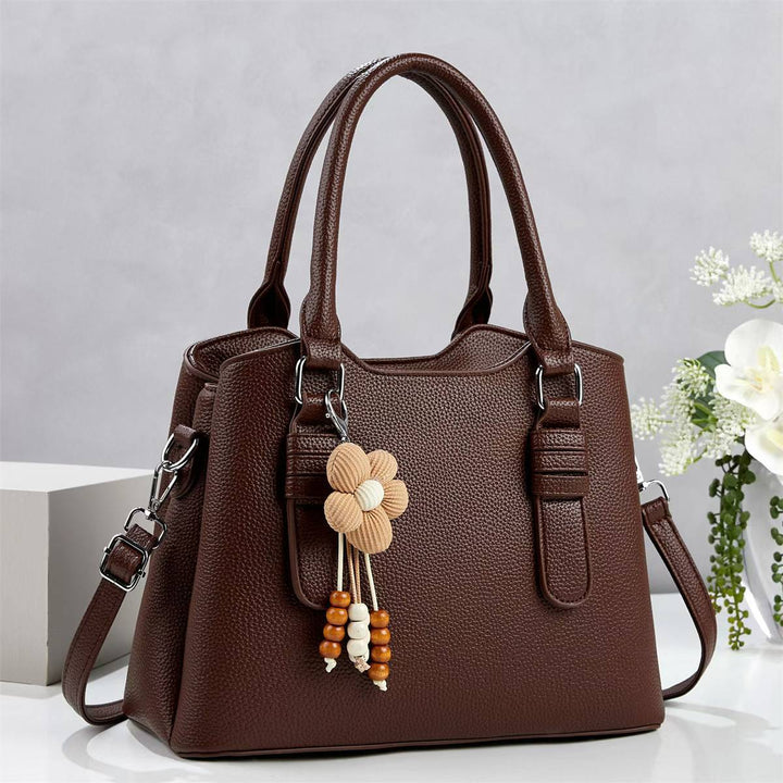 Damen elegante Handtasche mit verspieltem Anhänger Nord Taschen
