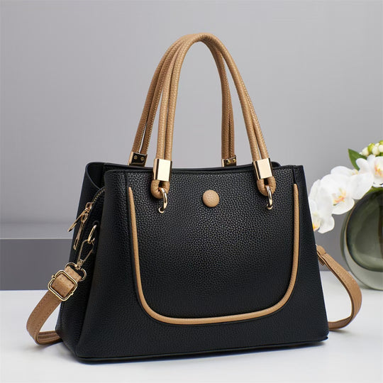Damen Handtasche mit goldenen Akzenten und eleganter Struktur Nord Taschen