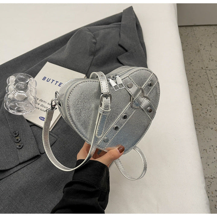 Nord Taschen | Umhängetasche für Damen - Herzförmige Crossbody-Tasche im auffälligen Design mit Riemenverschluss