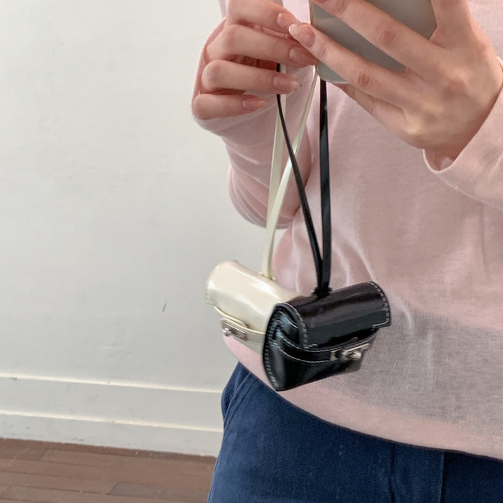 Damen Mini-Handtasche aus hochwertigem Kunstleder mit verspieltem Verschluss Nord Taschen