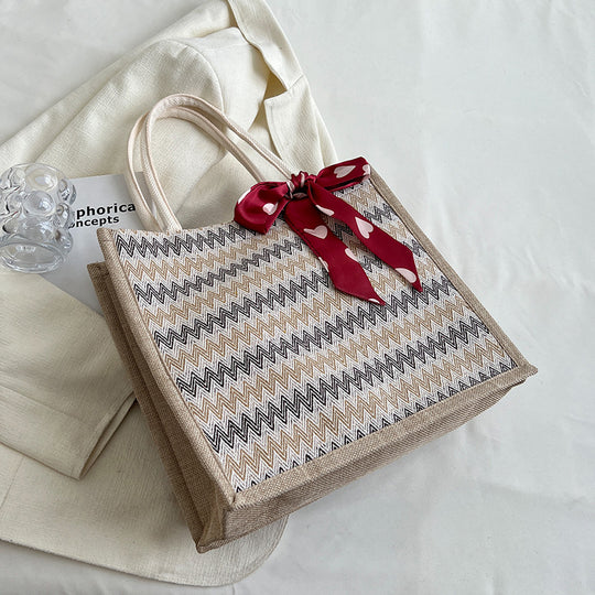 Damen Jute-Shopper mit modernem Wellenmuster und dekorativem Schleifenakzent Nord Taschen