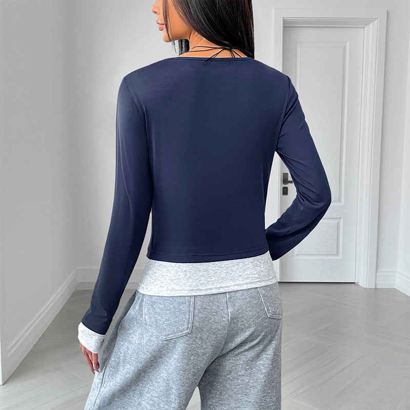 Damen Tailliertes Langarm-Crop-Top mit Henley-Knopfleiste und Daumenlochbündchen Nord Taschen