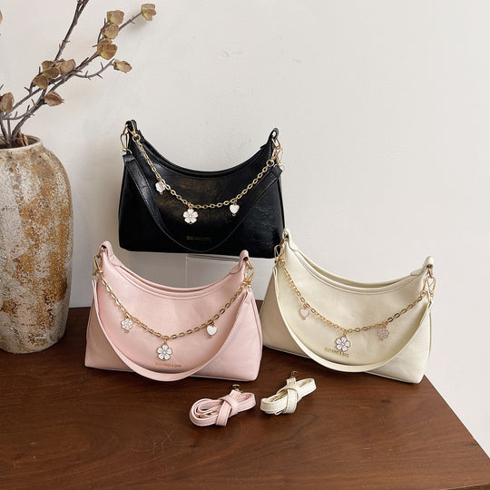 Damen Umhängetasche mit elegantem Ketten-Design und floralem Akzent Nord Taschen