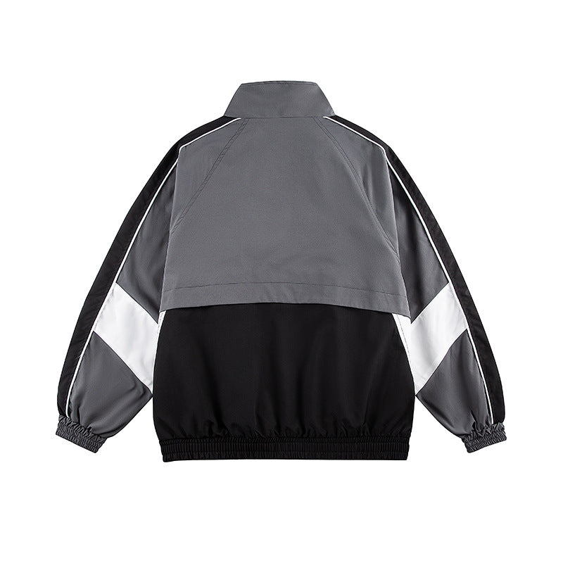 Unisex Kastig geschnittene Trackjacke im Retro-Sportstil mit hohem Stehkragen, Farbblock‑Einsätzen und elastischem Saum Nord Taschen