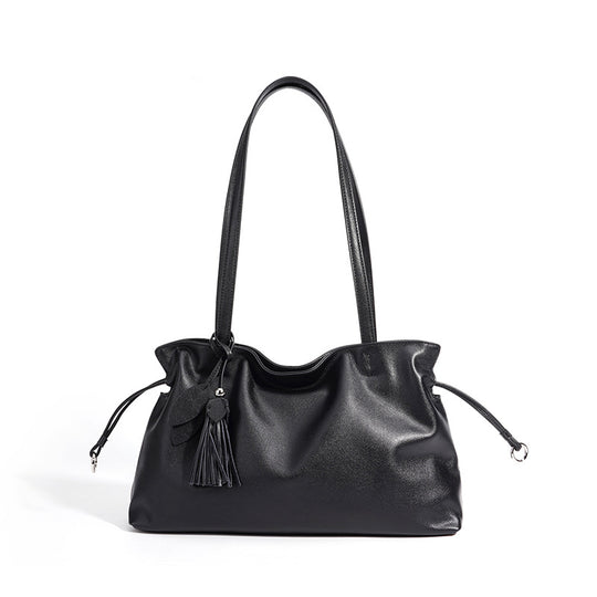 Damen Handtasche aus hochwertigem Kunstleder mit auffälligem Quastenanhänger Nord Taschen
