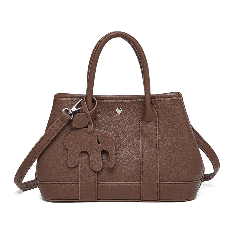 Damen Handtasche mit abnehmbarem Elefantenanhänger und elegantem Kunstleder Nord Taschen