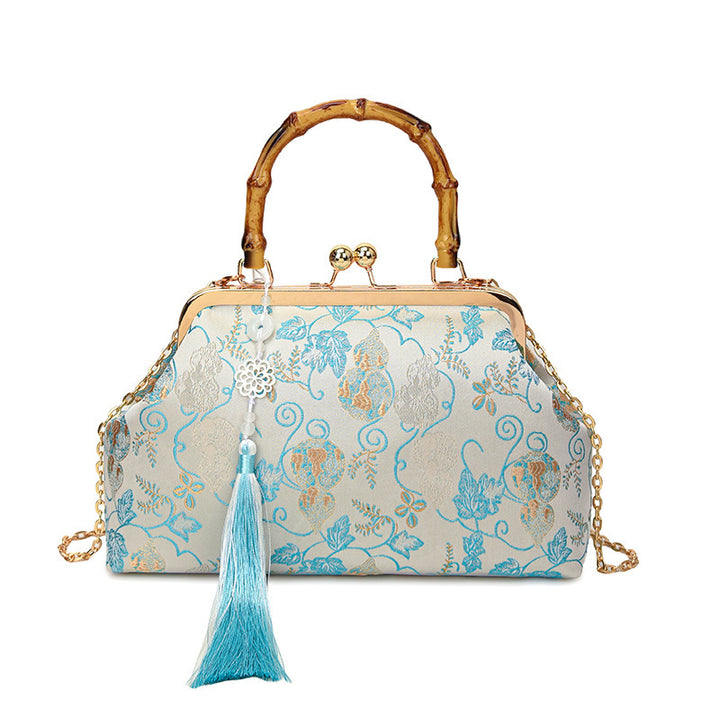 Damen elegante Handtasche mit Bambusgriffen und floralem Design Nord Taschen
