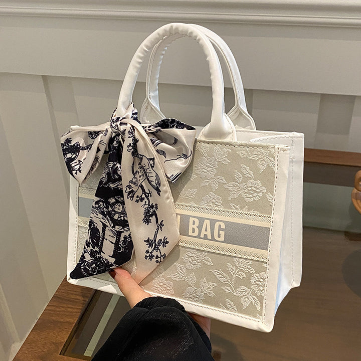 Damen Handtasche im eleganten Design mit dekorativem Schal Nord Taschen