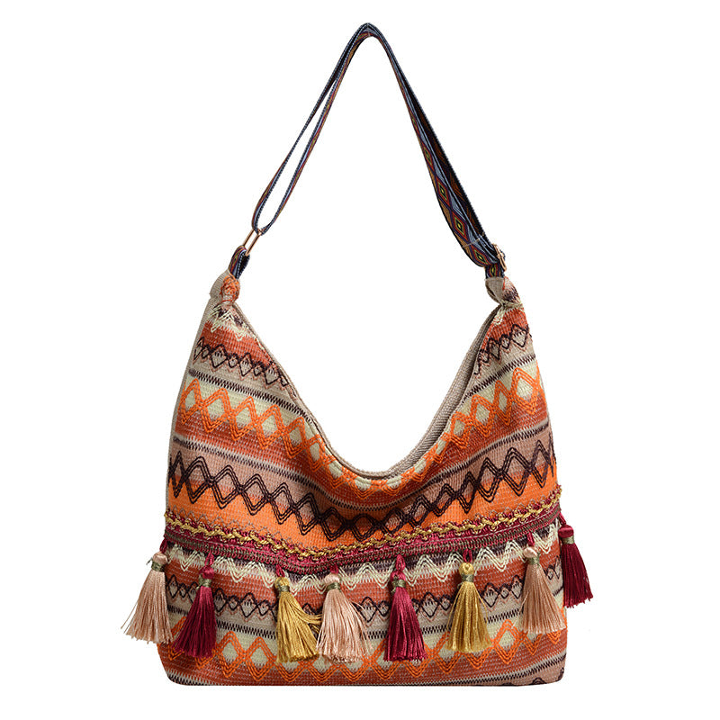 Damen Umhängetasche mit kunstvollem Ethnodesign und lebhaften Quasten Nord Taschen