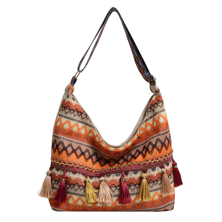 Damen Umhängetasche mit kunstvollem Ethnodesign und lebhaften Quasten Nord Taschen