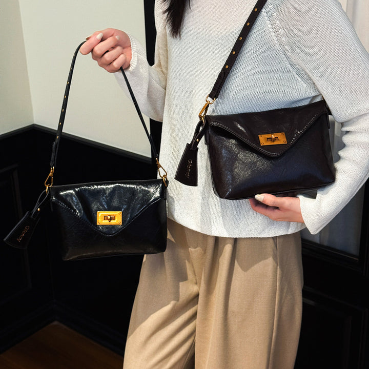 Damen Umhängetasche mit strukturierter Oberfläche und elegantem Drehverschluss Nord Taschen