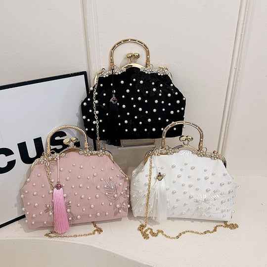 Damen elegante Handtasche mit perlenverziertem Design und Metallakzenten Nord Taschen