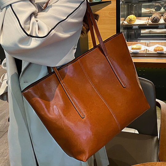 Damen Elegante Leder-Totetasche mit seitlichem Reißverschluss und geräumigem Innenraum Nord Taschen