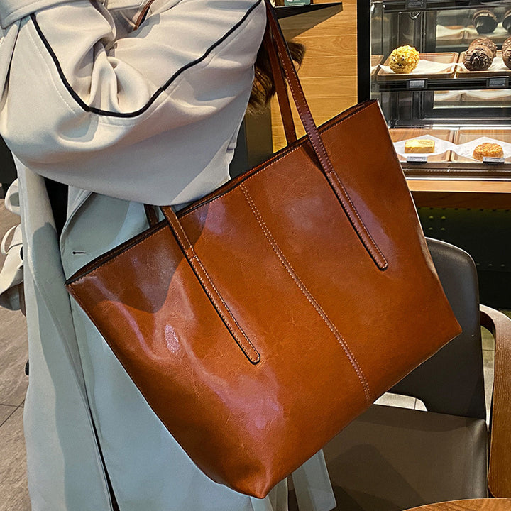 Damen Elegante Leder-Totetasche mit seitlichem Reißverschluss und geräumigem Innenraum Nord Taschen