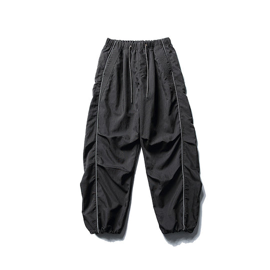 [Herren] weit geschnittene Nylon-Joggerhose im Utility-Stil mit Tunnelzugbund, Kontrastpaspel und elastischen Knöchelabschlüssen Nord Taschen