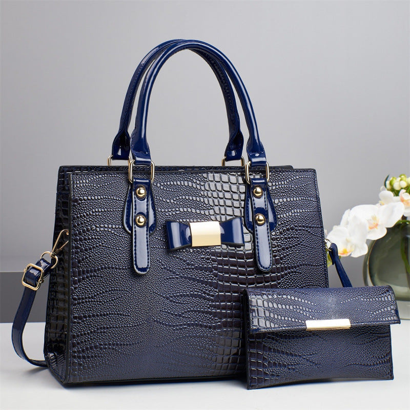 Damen elegante Handtasche mit schicker Schleifenapplikation und edlem Krokodil-Look Nord Taschen