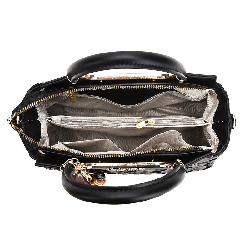 Damen elegante Handtasche mit kunstvollem Flechtmuster und abnehmbarer Quaste Nord Taschen