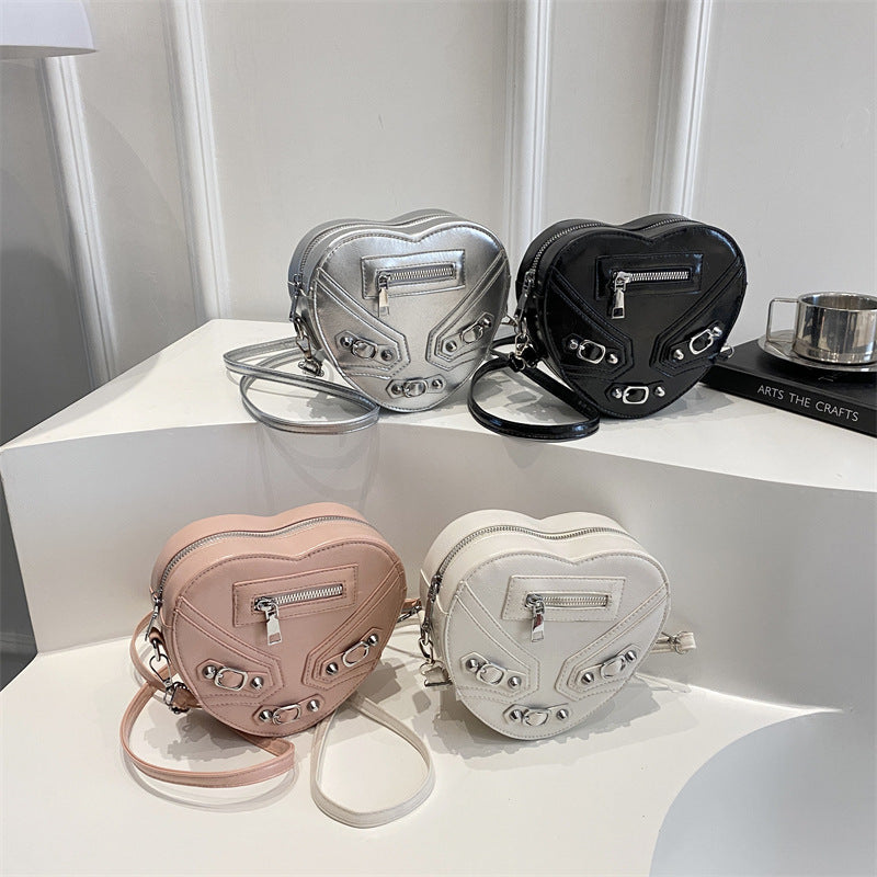 Damen herzförmige Handtasche mit verziertem Reißverschluss Nord Taschen