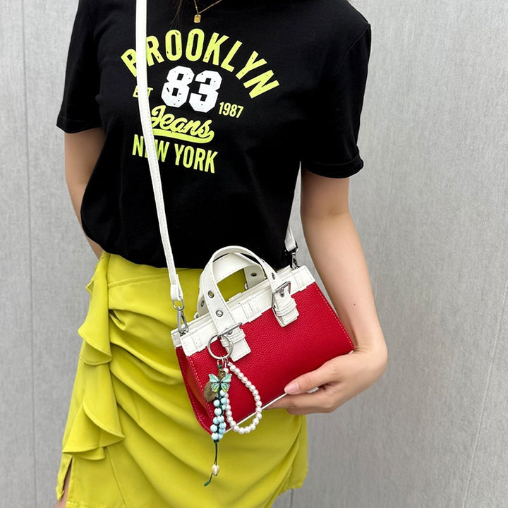 Damen Mini-Handtasche mit verspieltem Anhänger und elegantem Design Nord Taschen