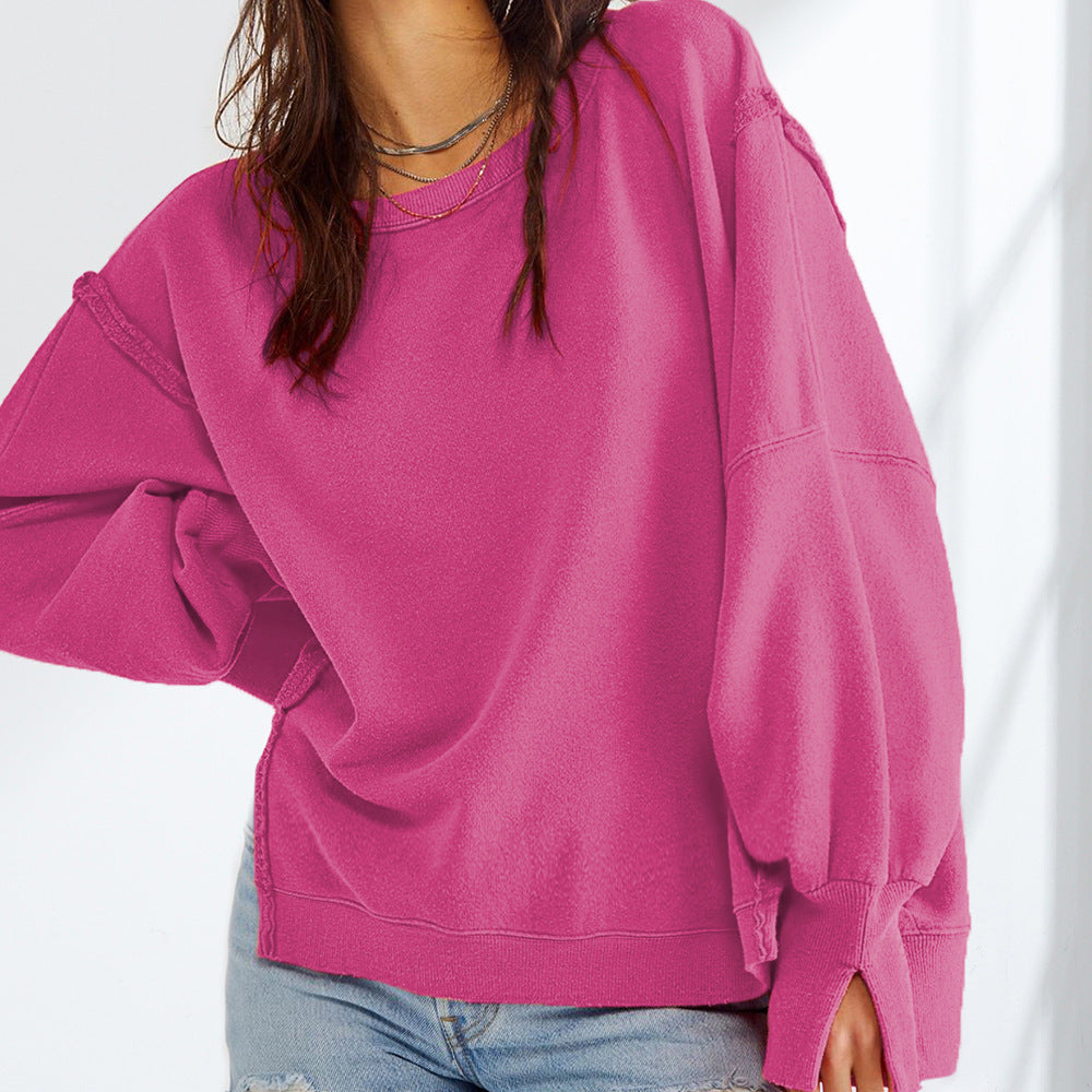 Damen Oversized Sweatshirt mit Ballonärmeln, seitlichen Schlitzen und offenen Kanten Nord Taschen