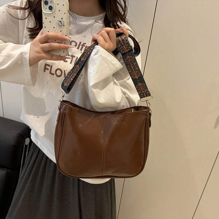 Damen elegante Umhängetasche mit kunstvollem Tragegurt Nord Taschen