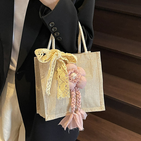 Damen Handtasche mit floralen Details und romantischem Bogen Nord Taschen