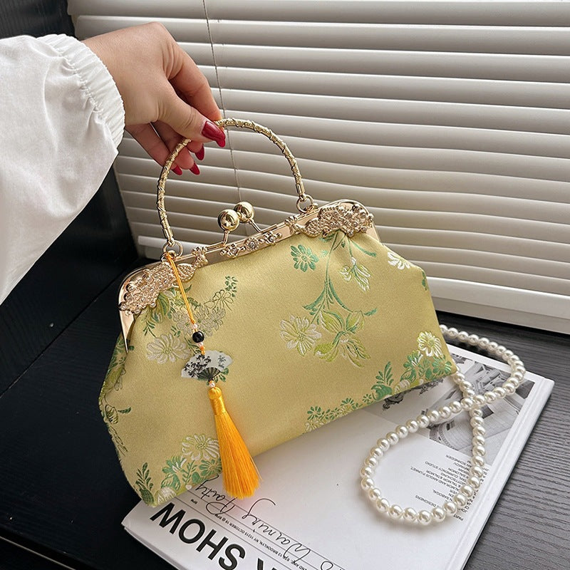 Damen elegante Umhängetasche mit floralem Design und goldenen Akzenten Nord Taschen