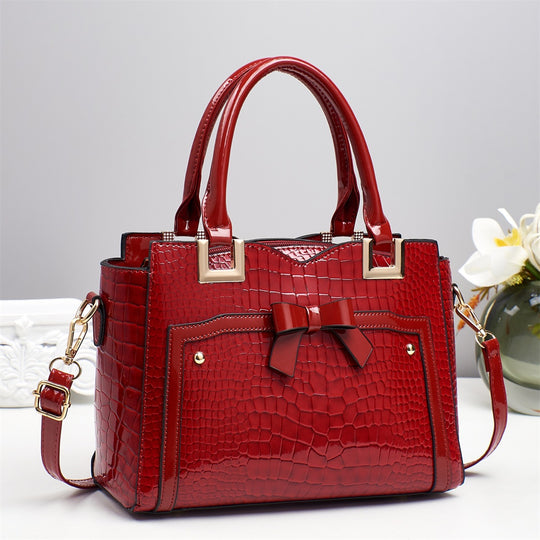 Damen elegante Handtasche mit dekorativem Schleifen-Detail und strukturiertem Krokodil-Leder-Look Nord Taschen