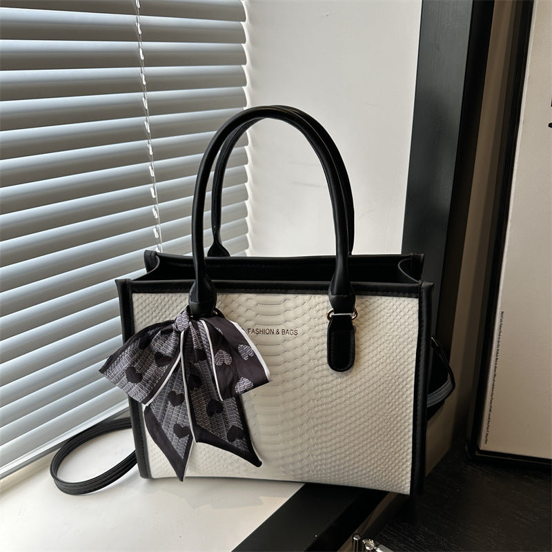 Damen stilvolle Handtasche mit geflochtenem Design und dekorativem Schleifenband Nord Taschen
