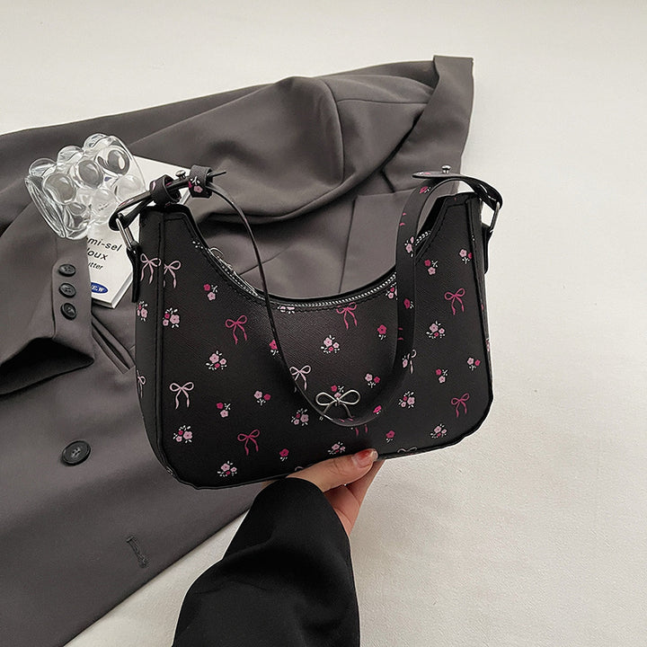 Damen Umhängetasche mit floralen Applikationen und verspieltem Schleifenverschluss Nord Taschen