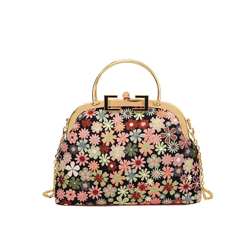Damen elegante Umhängetasche mit floralen Akzenten und goldenen Verzierungen Nord Taschen