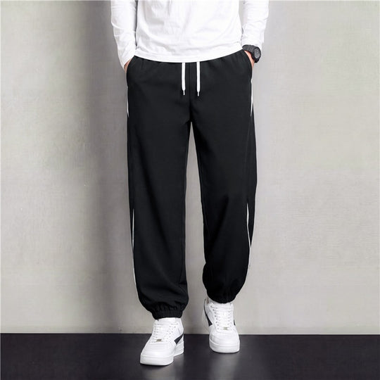 Herren Athleisure Jogginghose im Baggy‑Schnitt mit elastischem Bund, Tunnelzug und seitlichen Kontrastkeilen Nord Taschen