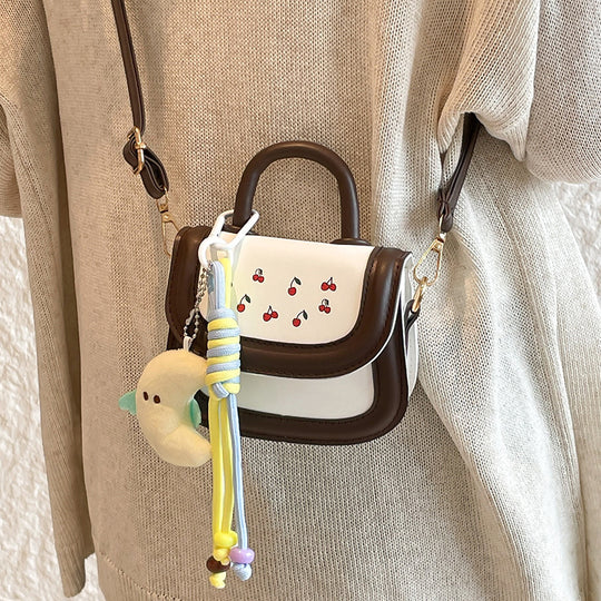 Damen Mini-Handtasche mit fröhlichem Kirschdesign und charmanten Anhängern Nord Taschen